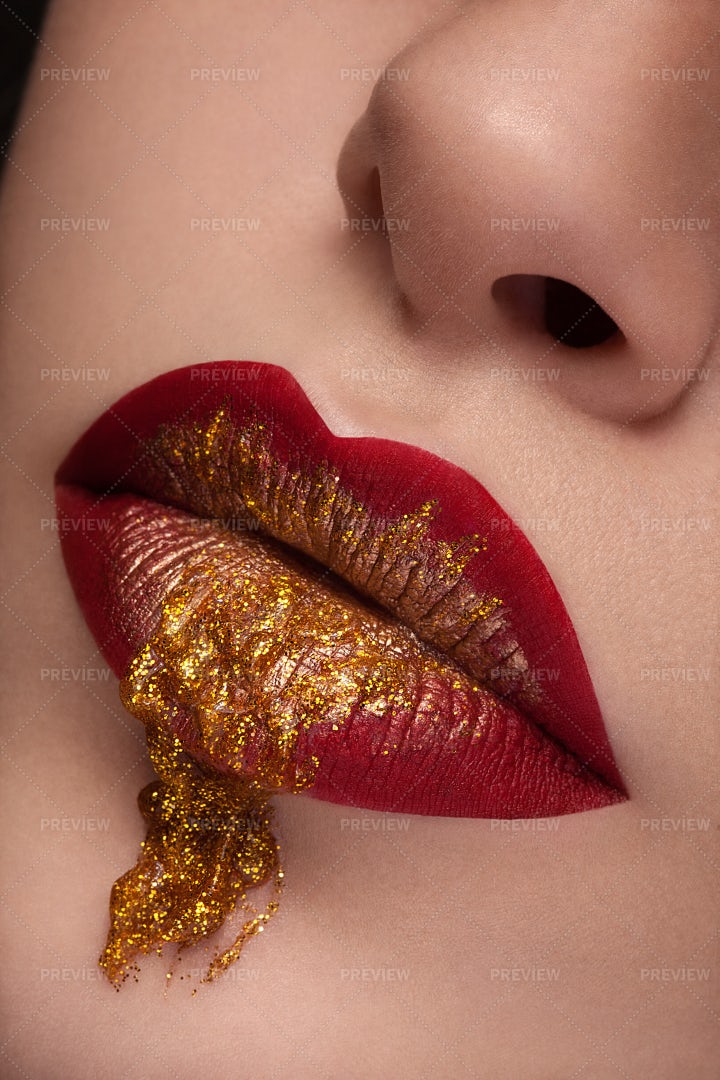Close Up Red Lips With Gold Liquid: Stock Photos