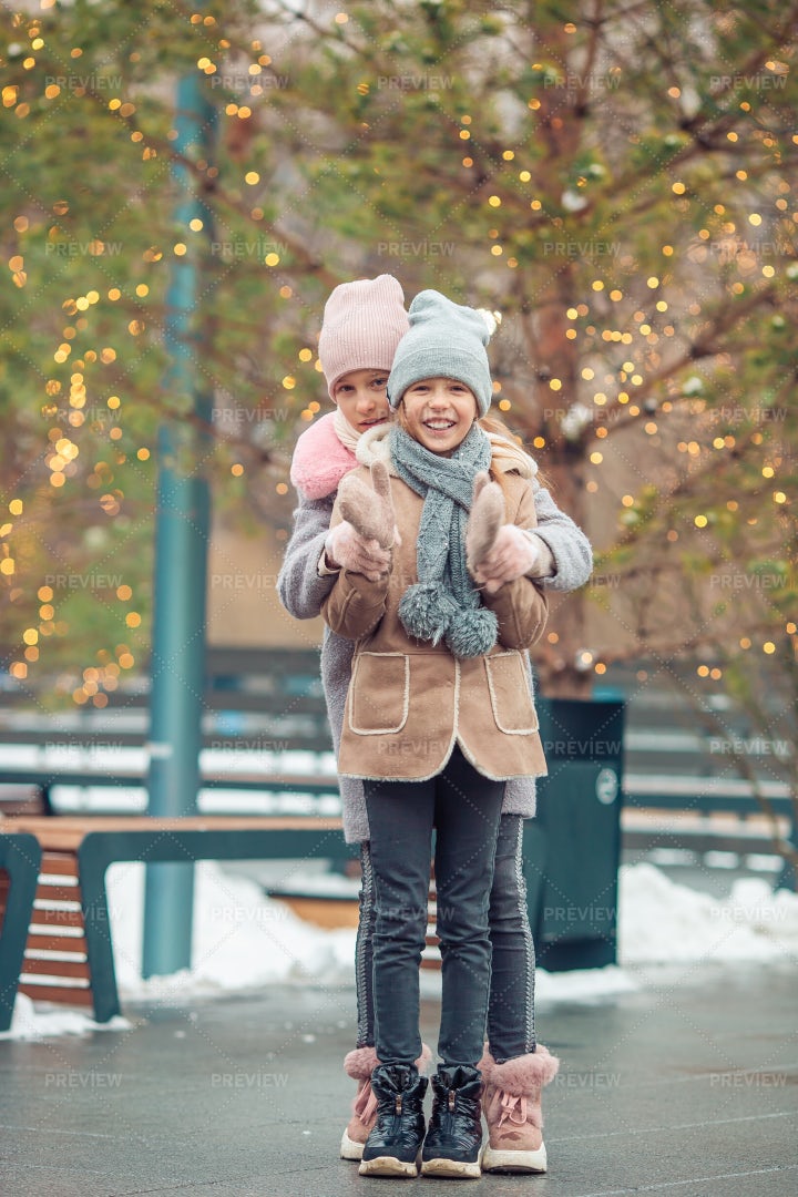 Sisters Hugging Outside: Stock Photos