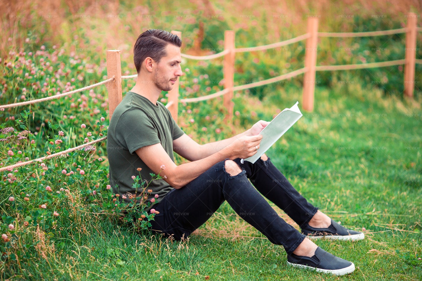 Man Reading A Book In A Park: Stock Photos