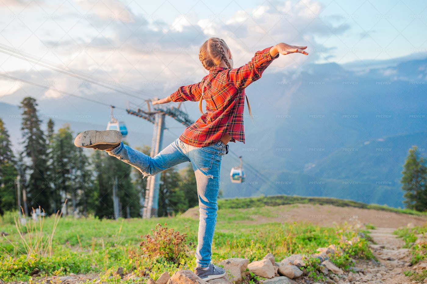 Happy Little Girl In Mountains: Stock Photos