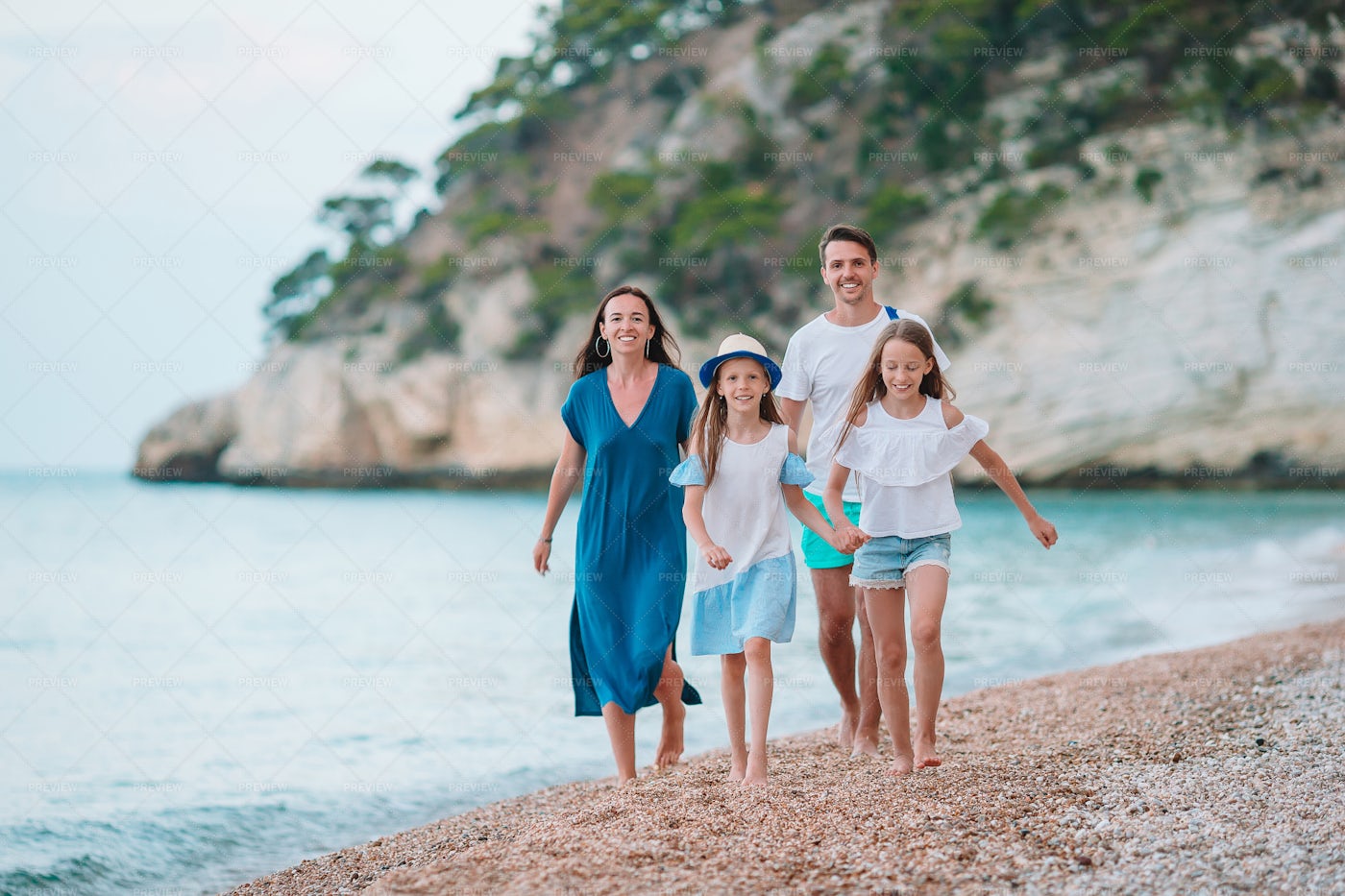 Family On Beach Pebbles: Stock Photos