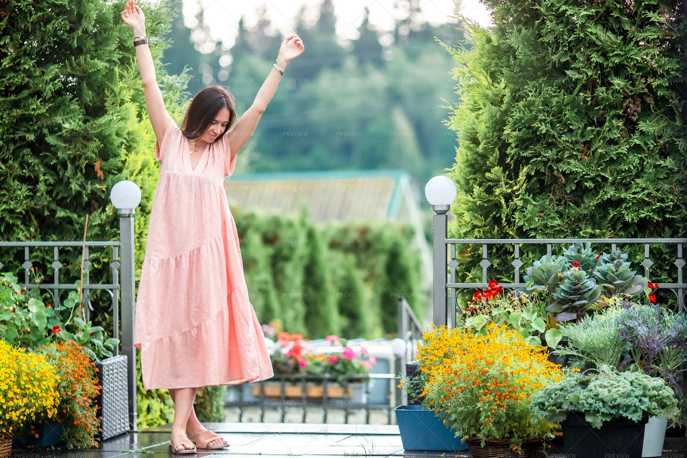 Happy Woman In A Flower Garden: Stock Photos