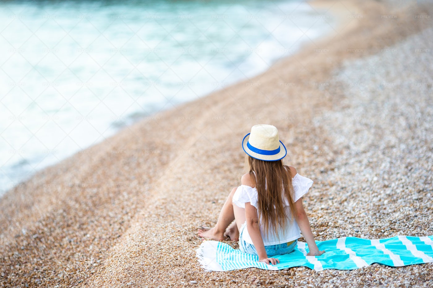 Child Sitting On Beach Towel: Stock Photos