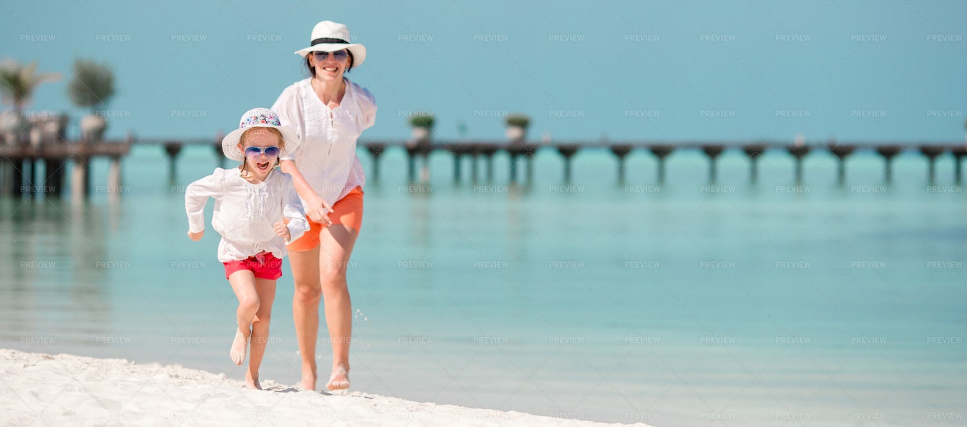 Chasing Daughter On The Beach: Stock Photos