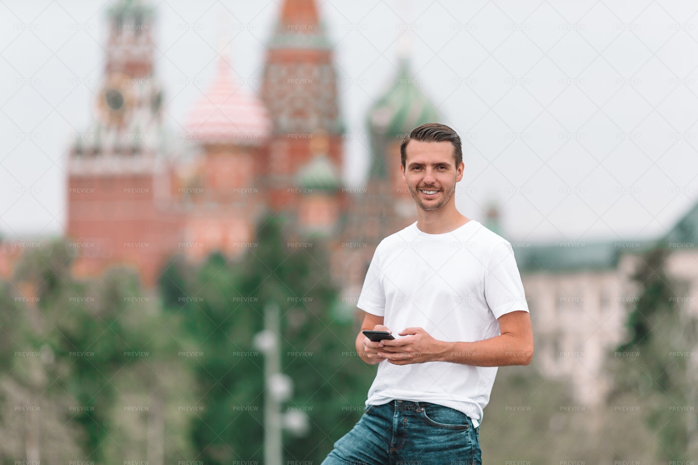 Man Texting In Red Square: Stock Photos