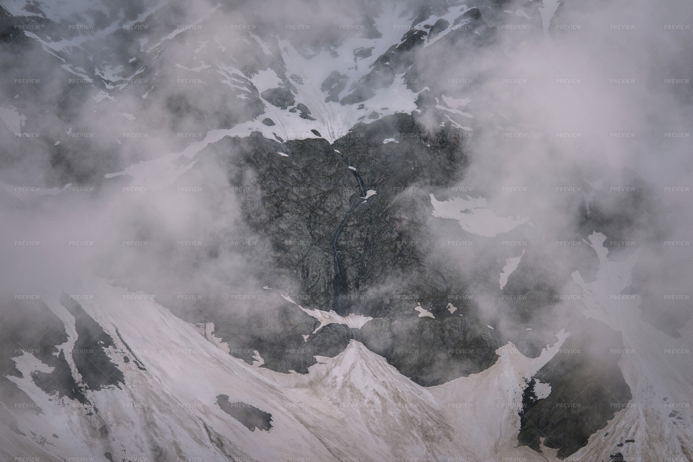 Waterfall In The Snowy Mountains: Stock Photos
