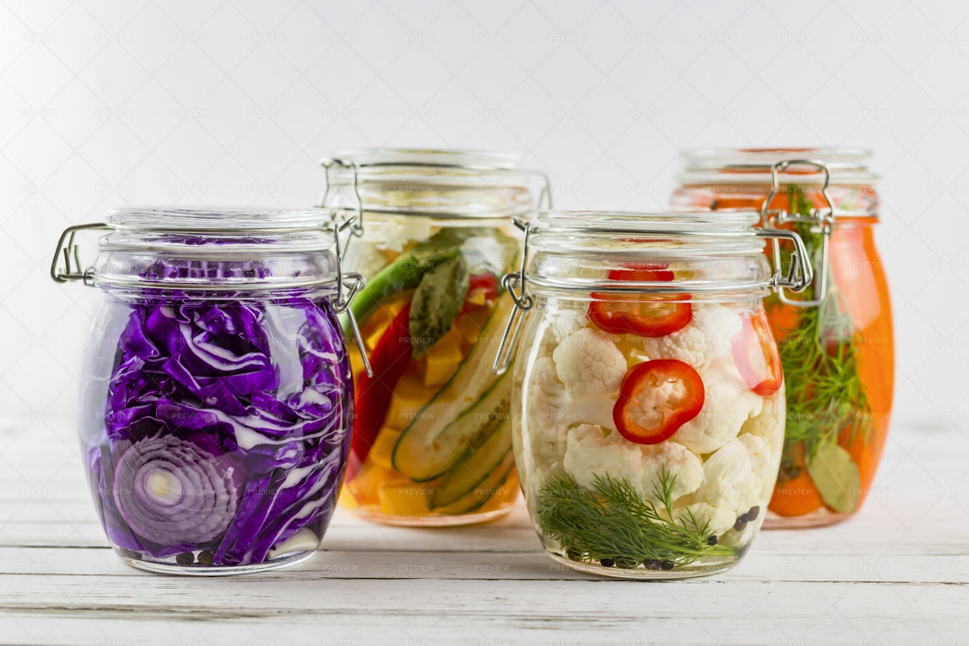 Four Containers Of Fermented Vegetables: Stock Photos
