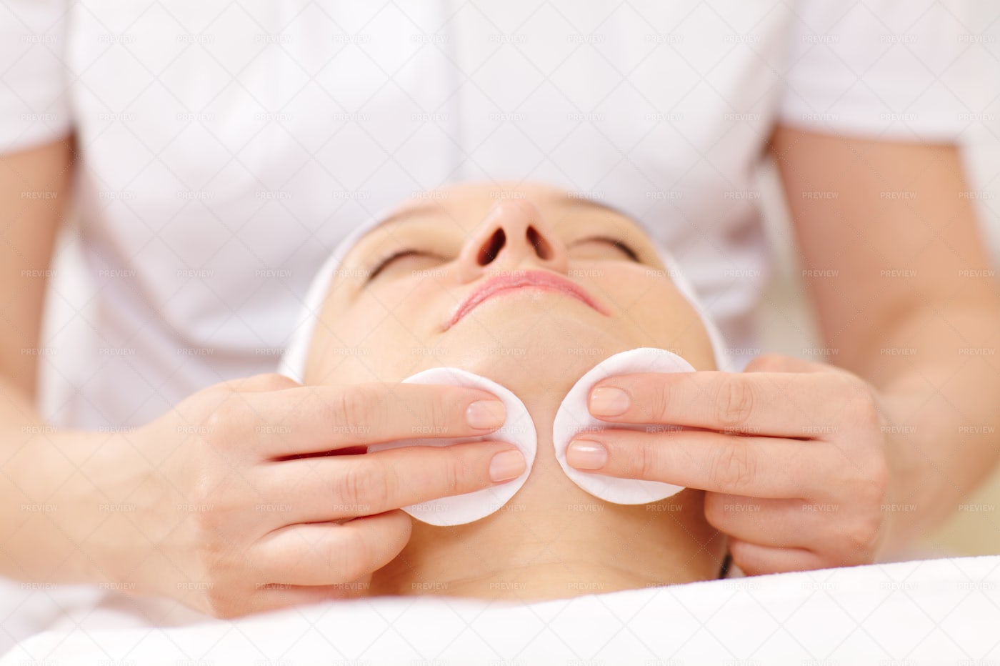 Cosmetician Cleaning A Face: Stock Photos
