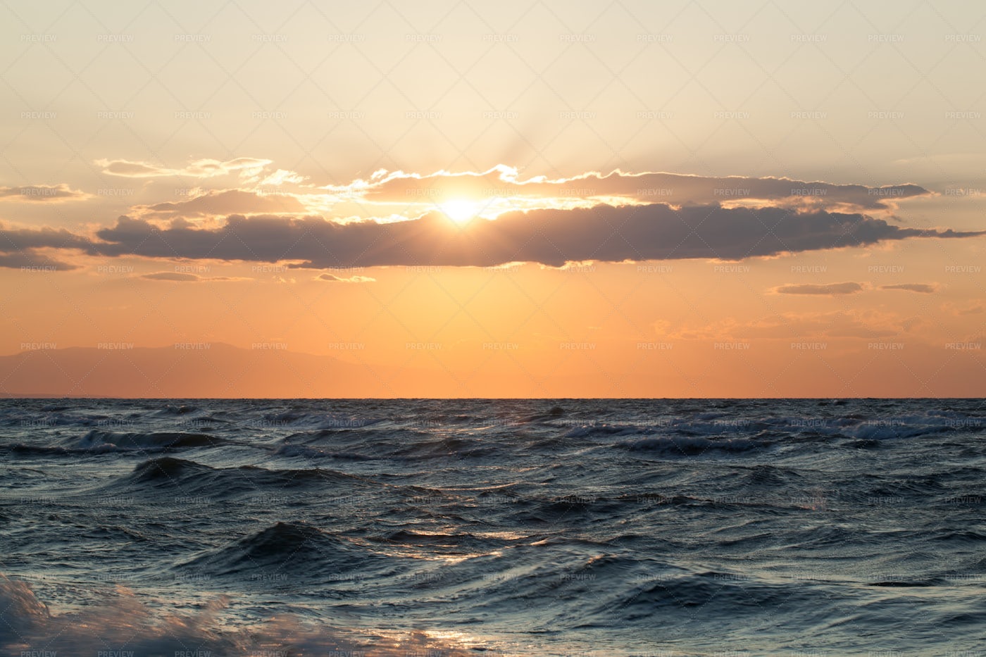 Sunset Over Rough Sea: Stock Photos
