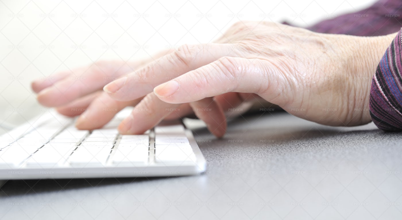 Old Female Typing: Stock Photos