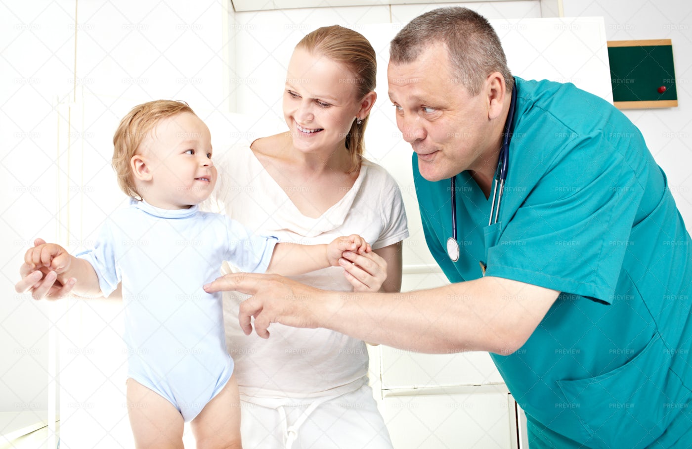 Happy Baby At The Doctor: Stock Photos