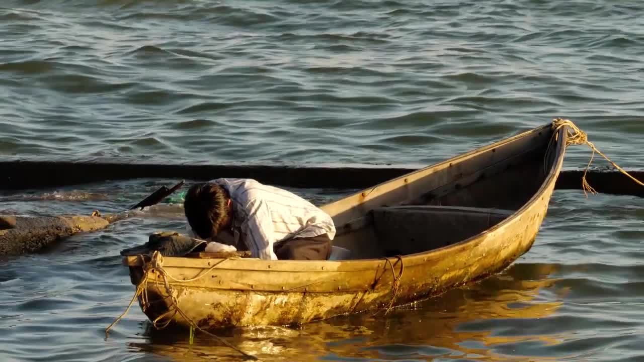 fisherman-in-a-boat-stock-video-motion-array