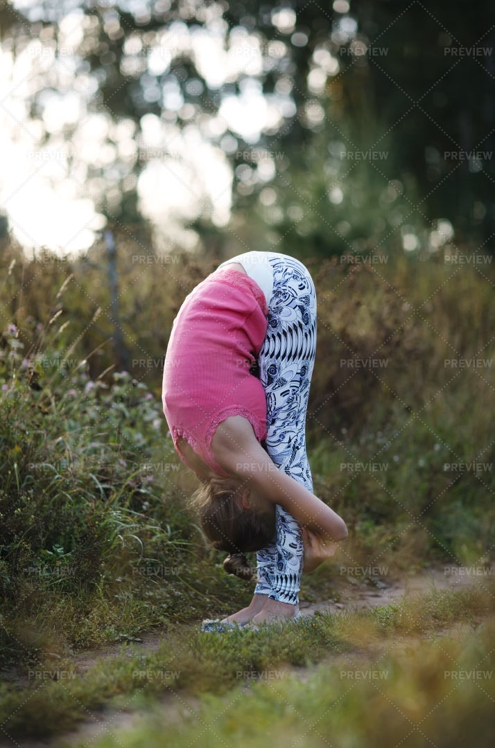 Supple Young Woman Bending: Stock Photos