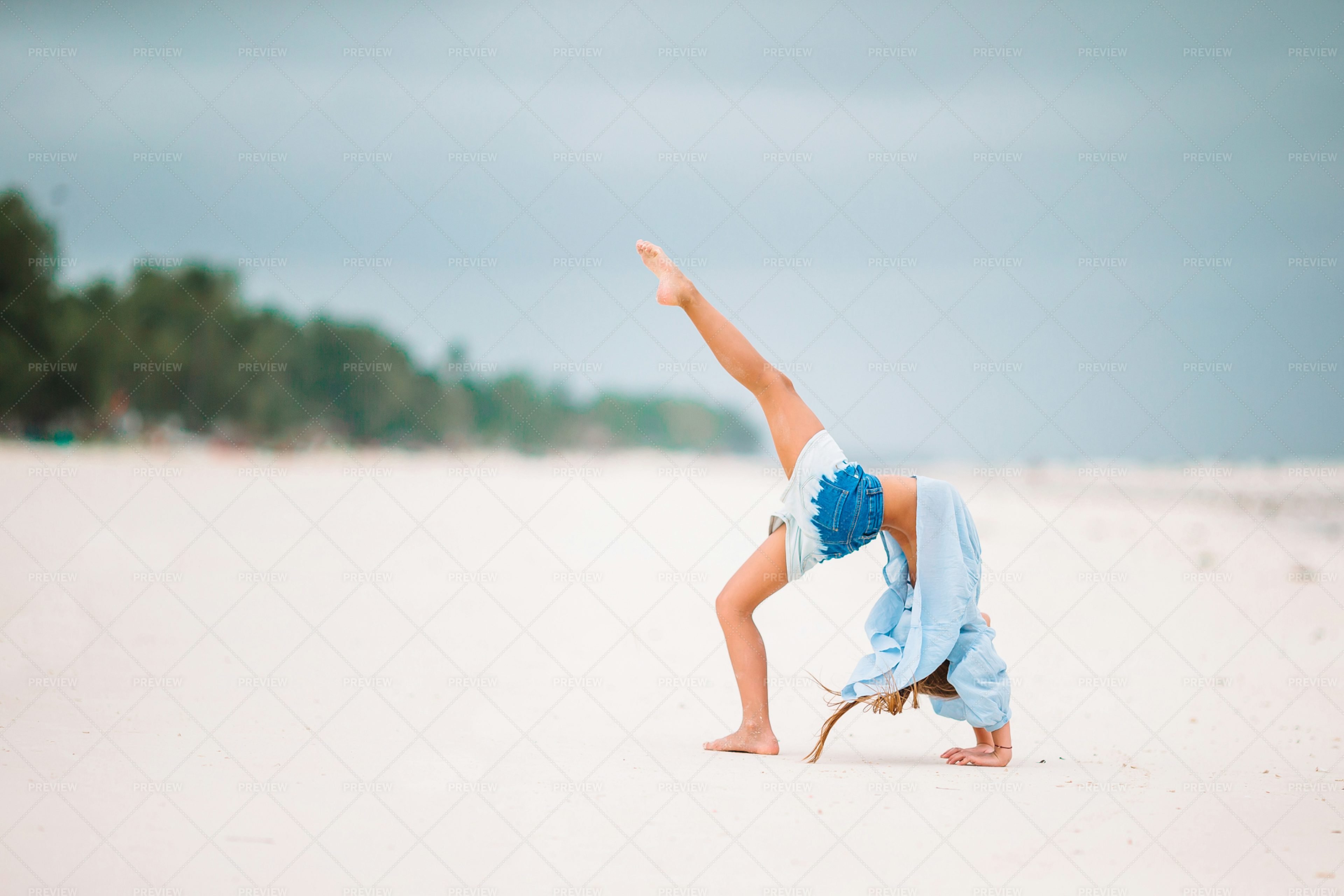 Doing Gymnastics On The Beach - Stock Photos | Motion Array