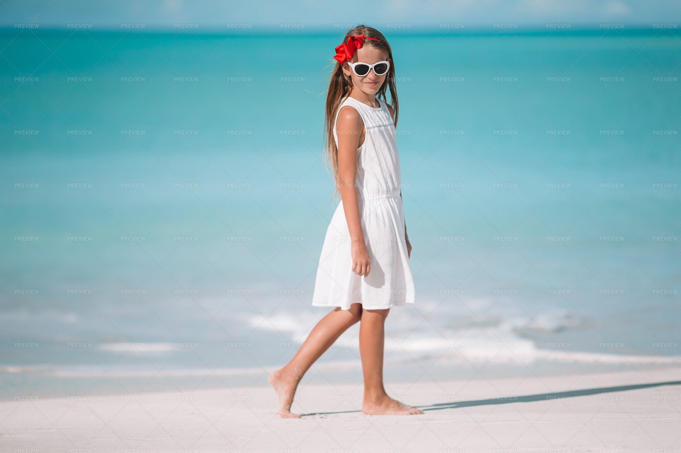 Girl In Front Of The Beach: Stock Photos