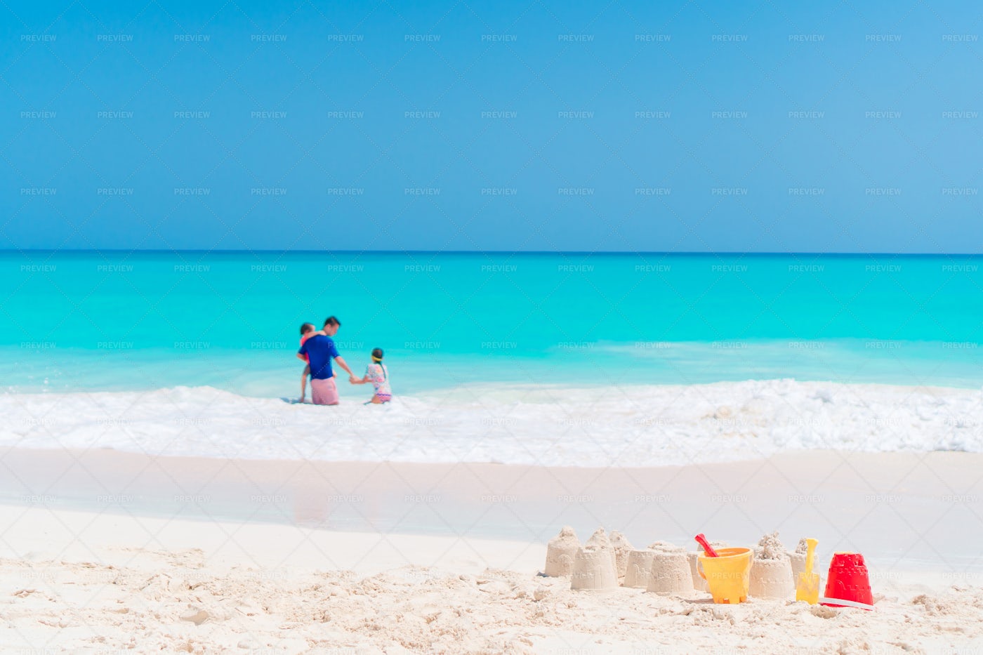 Sandcastle And Family Fun: Stock Photos