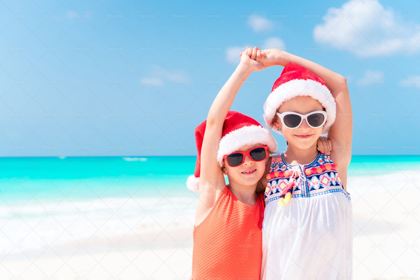 Sisters Enjoy A Summer Christmas: Stock Photos