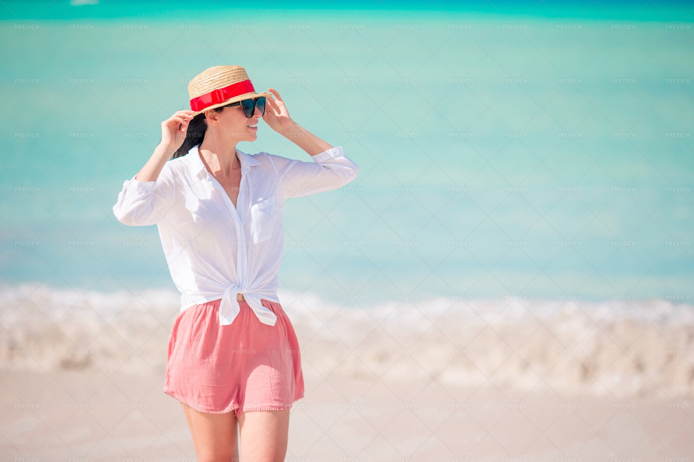 Wearing A Hat On The Beach: Stock Photos
