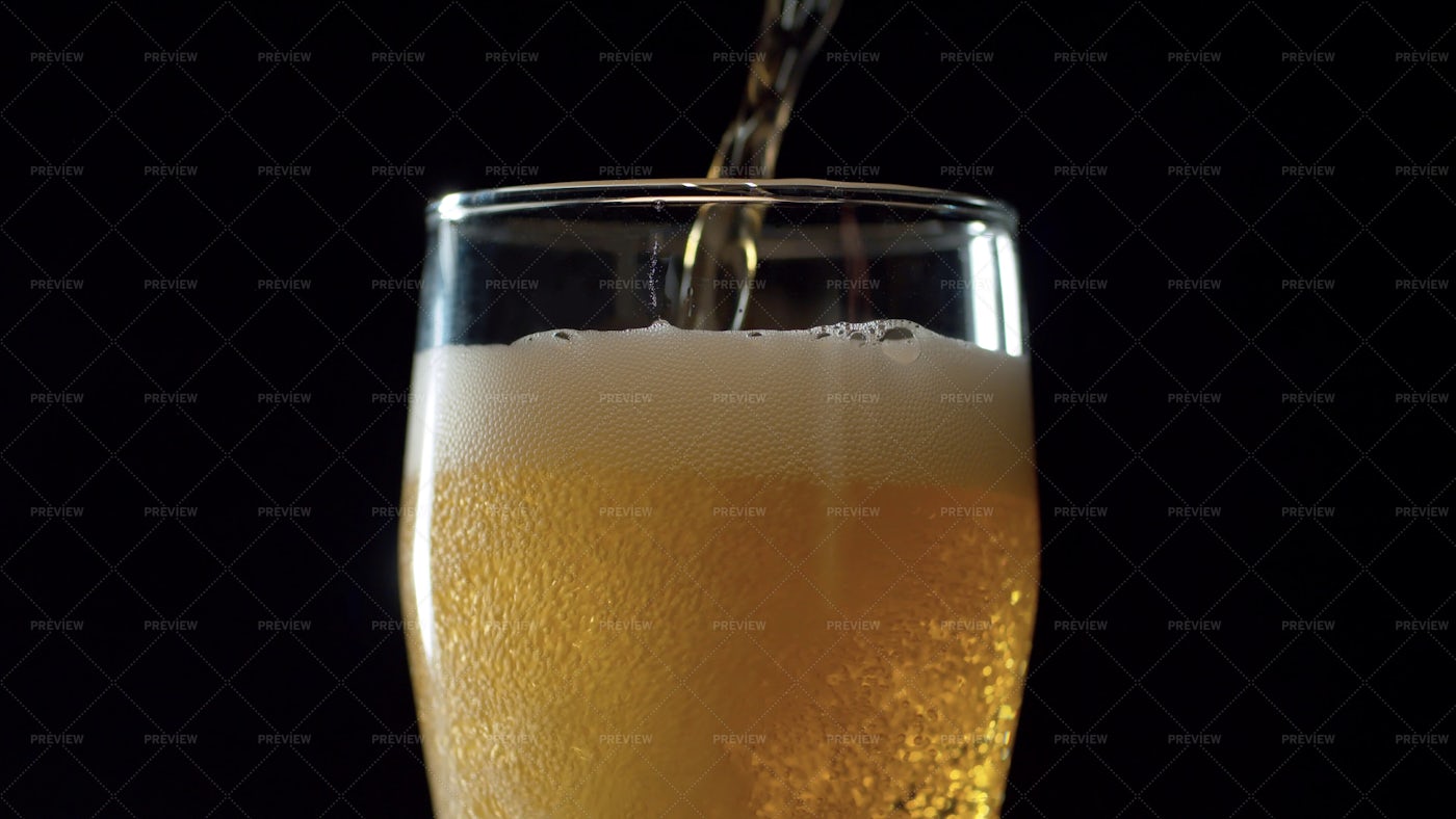 Beer Pouring Into A Pint Glass: Stock Photos