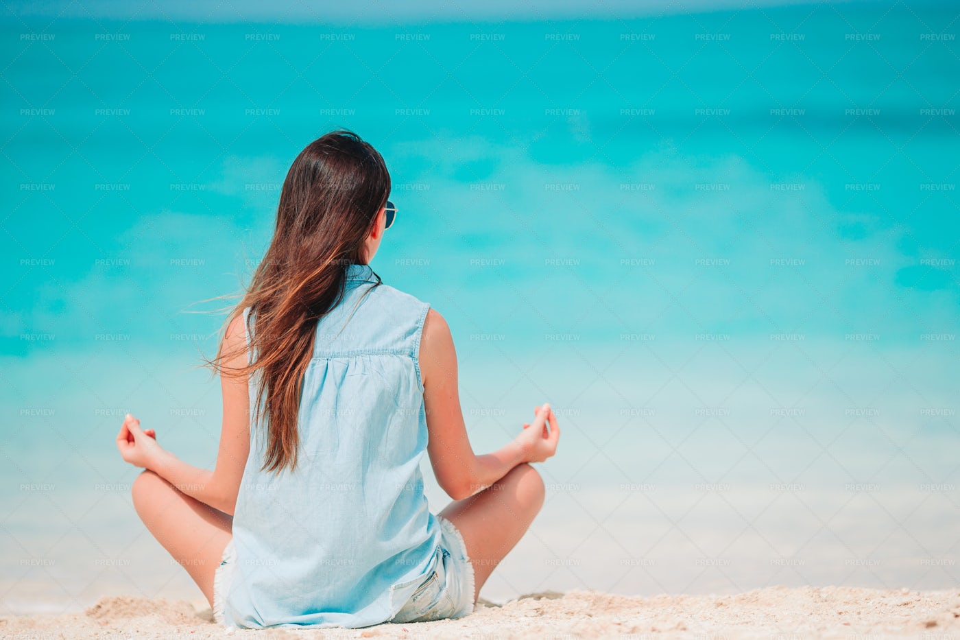 Woman Conducts Beach Meditation: Stock Photos