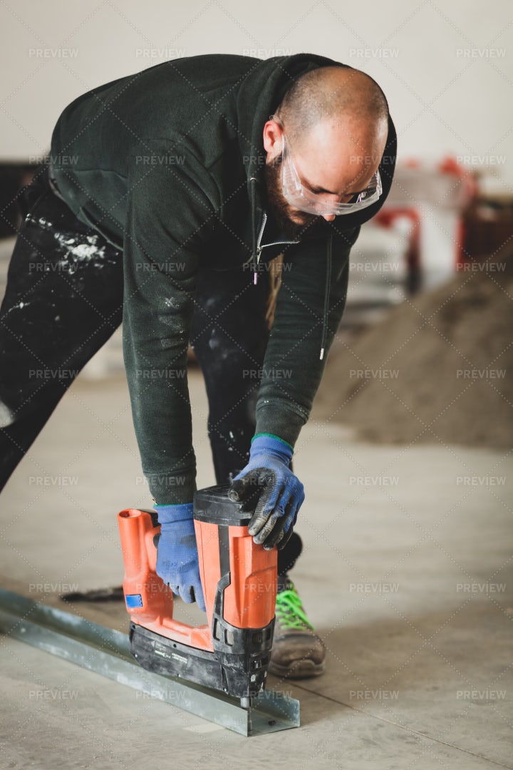 Worker Building A Plasterboard Wall: Stock Photos