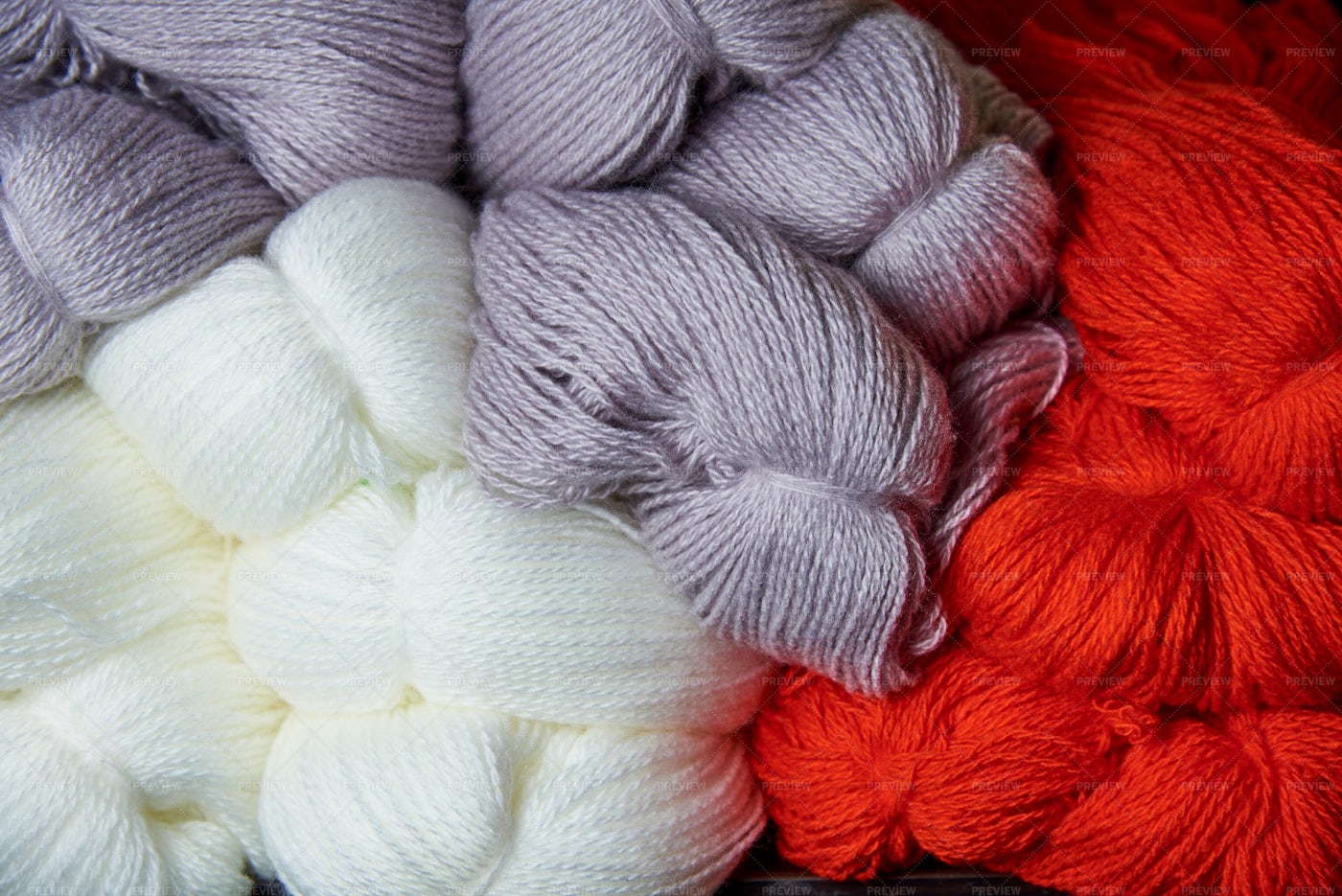 White, Purple And Red Yarn: Stock Photos