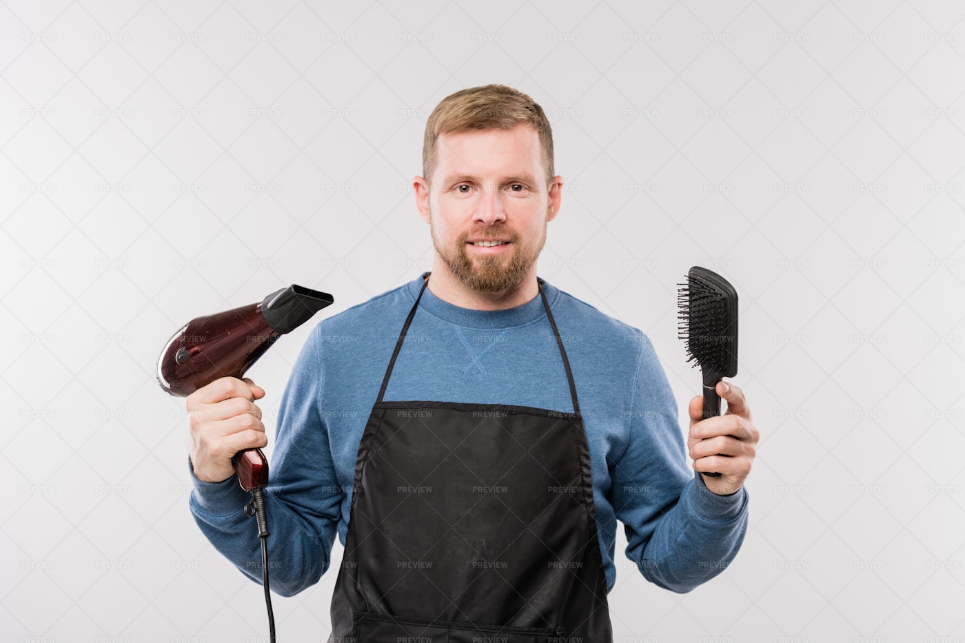 Happy Young Bearded Hairdresser In...: Stock Photos