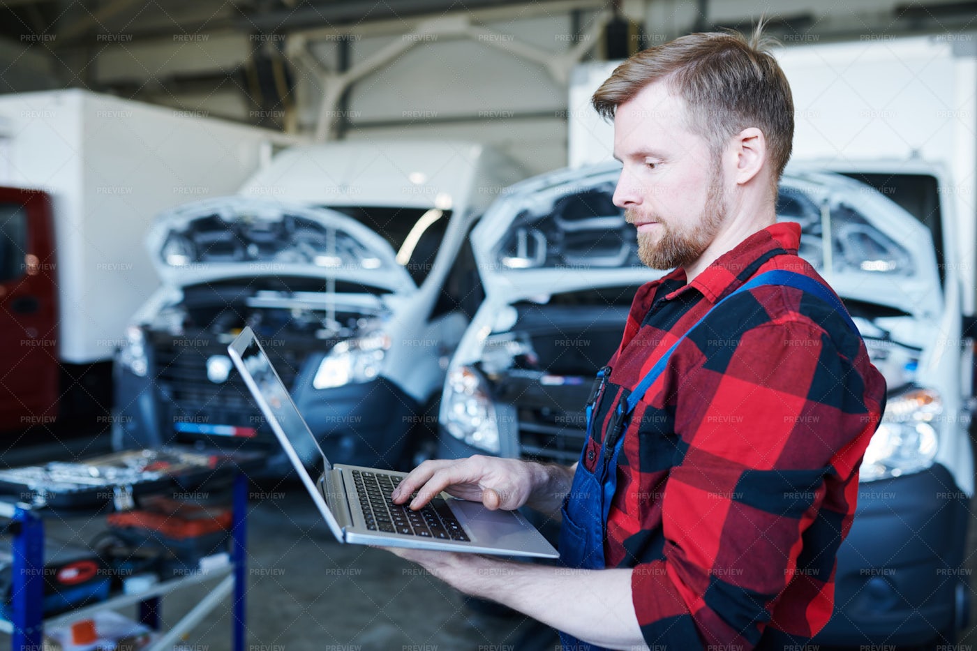 Mechanic Browsing In The Net: Stock Photos