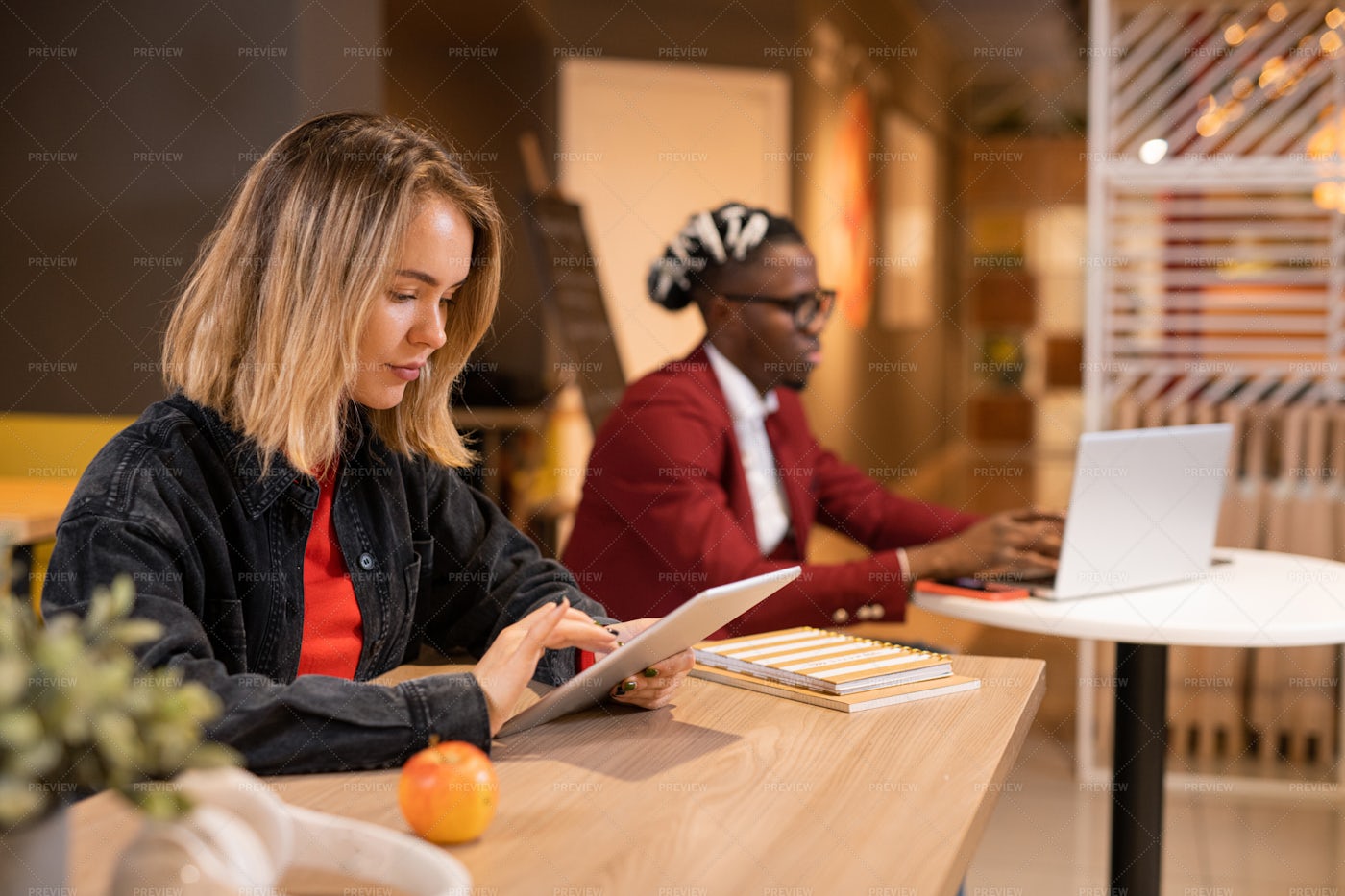 Serious Blonde Girl Sitting By...: Stock Photos