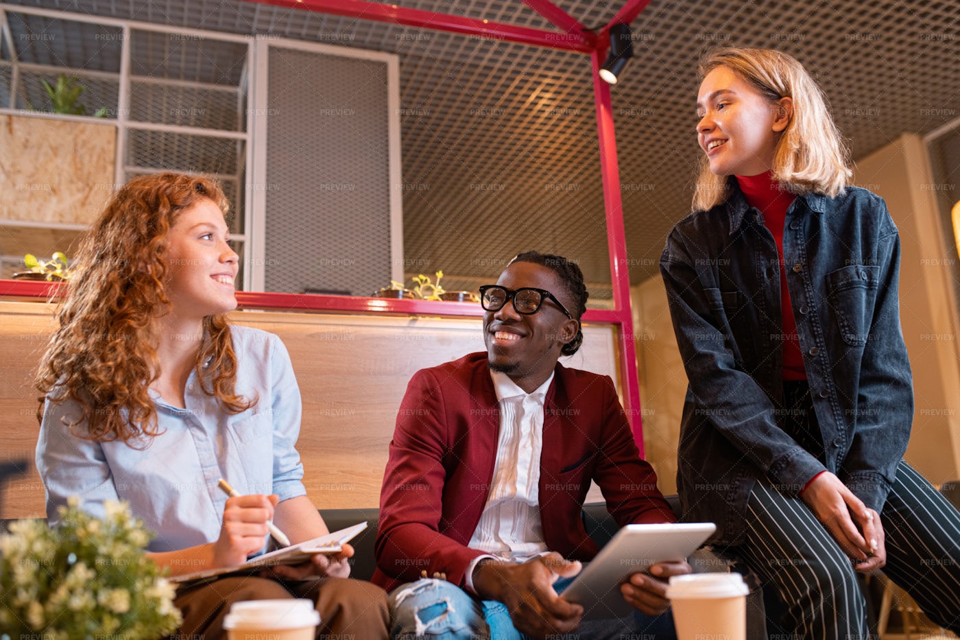 Three Young Cheerful Managers...: Stock Photos