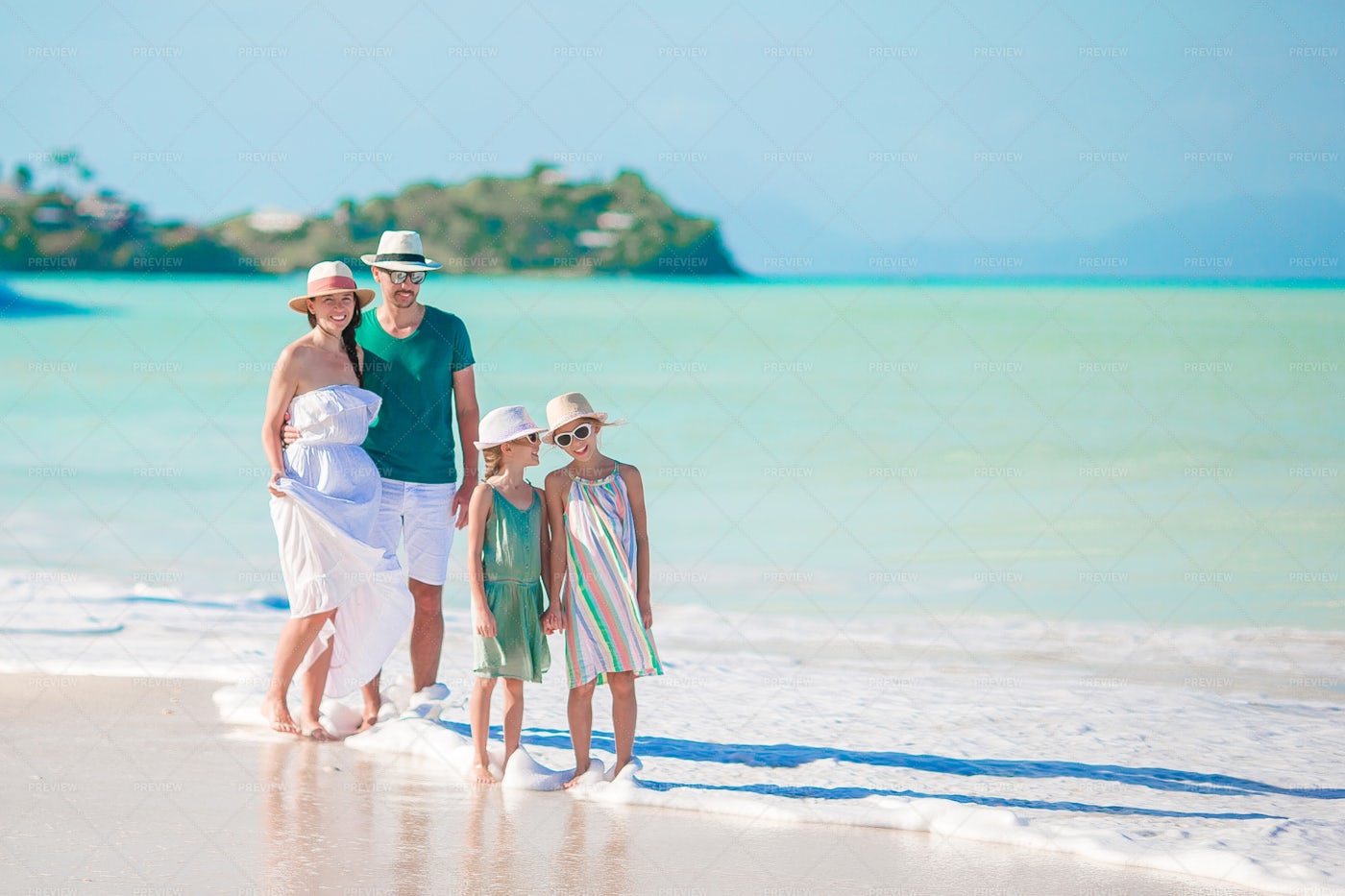 Young Family On The Beach: Stock Photos