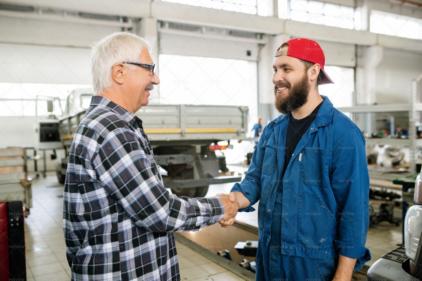 Happy Young Bearded Repairman Of...: Stock Photos