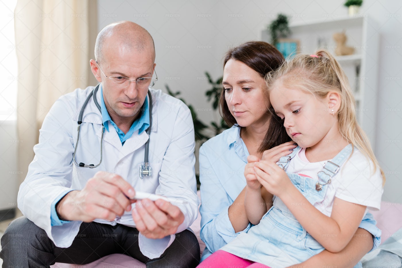 Serious Bald Doctor With...: Stock Photos
