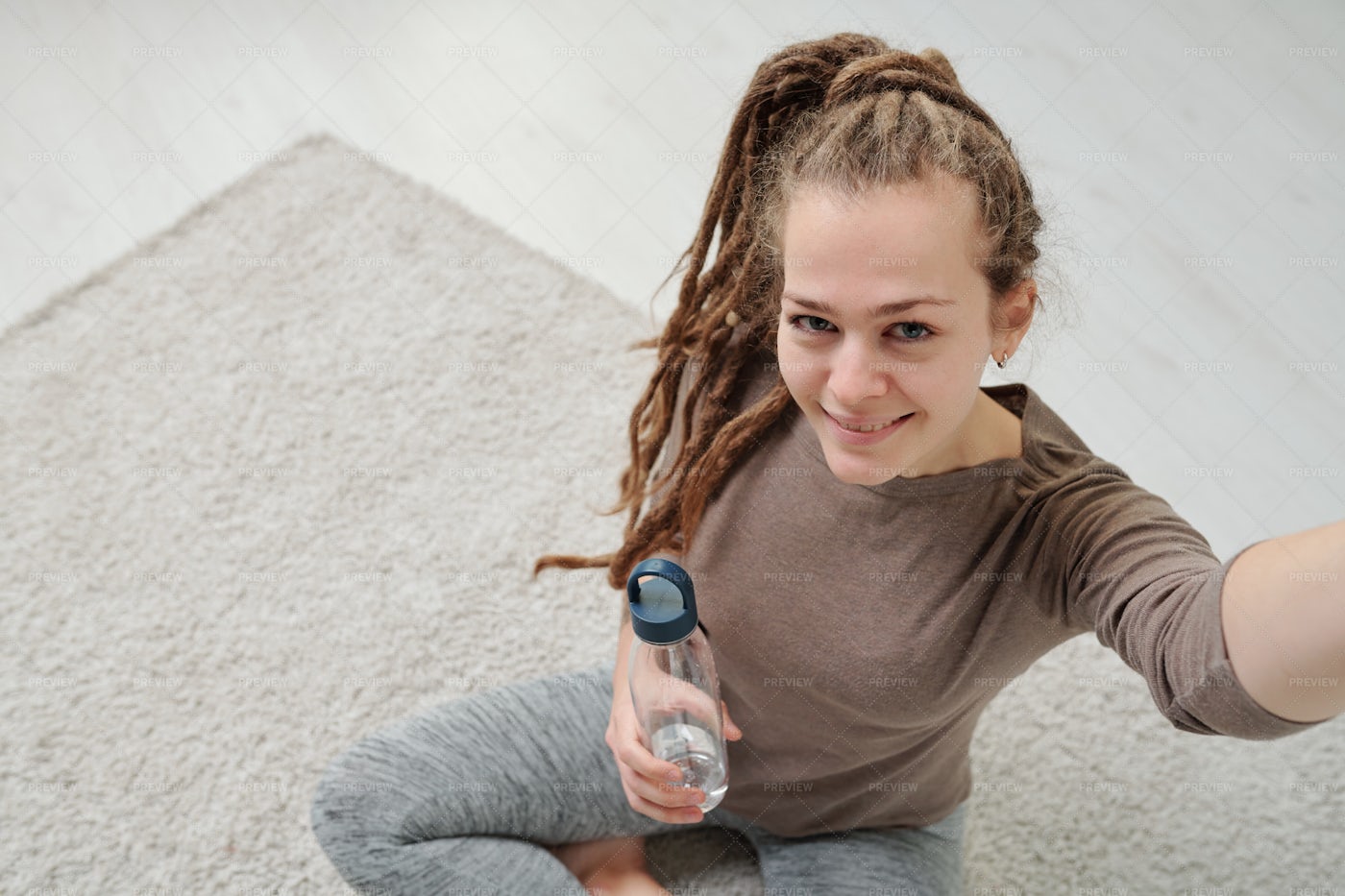 Active Smiling Girl With Bottle Of...: Stock Photos