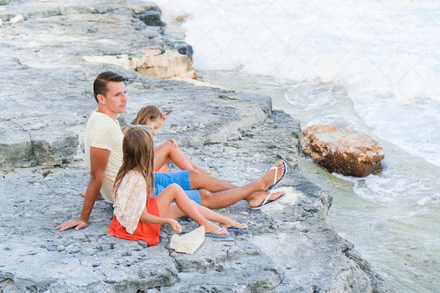 Sitting On The Beach Rocks: Stock Photos