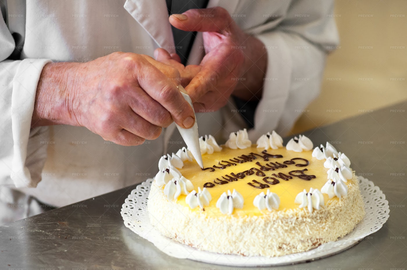 Baker Writing Birthday Message: Stock Photos