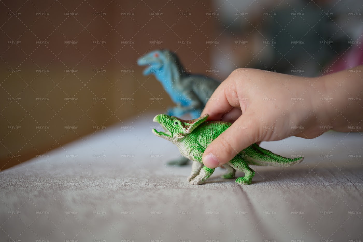 Child Playing With Dinosaurs: Stock Photos