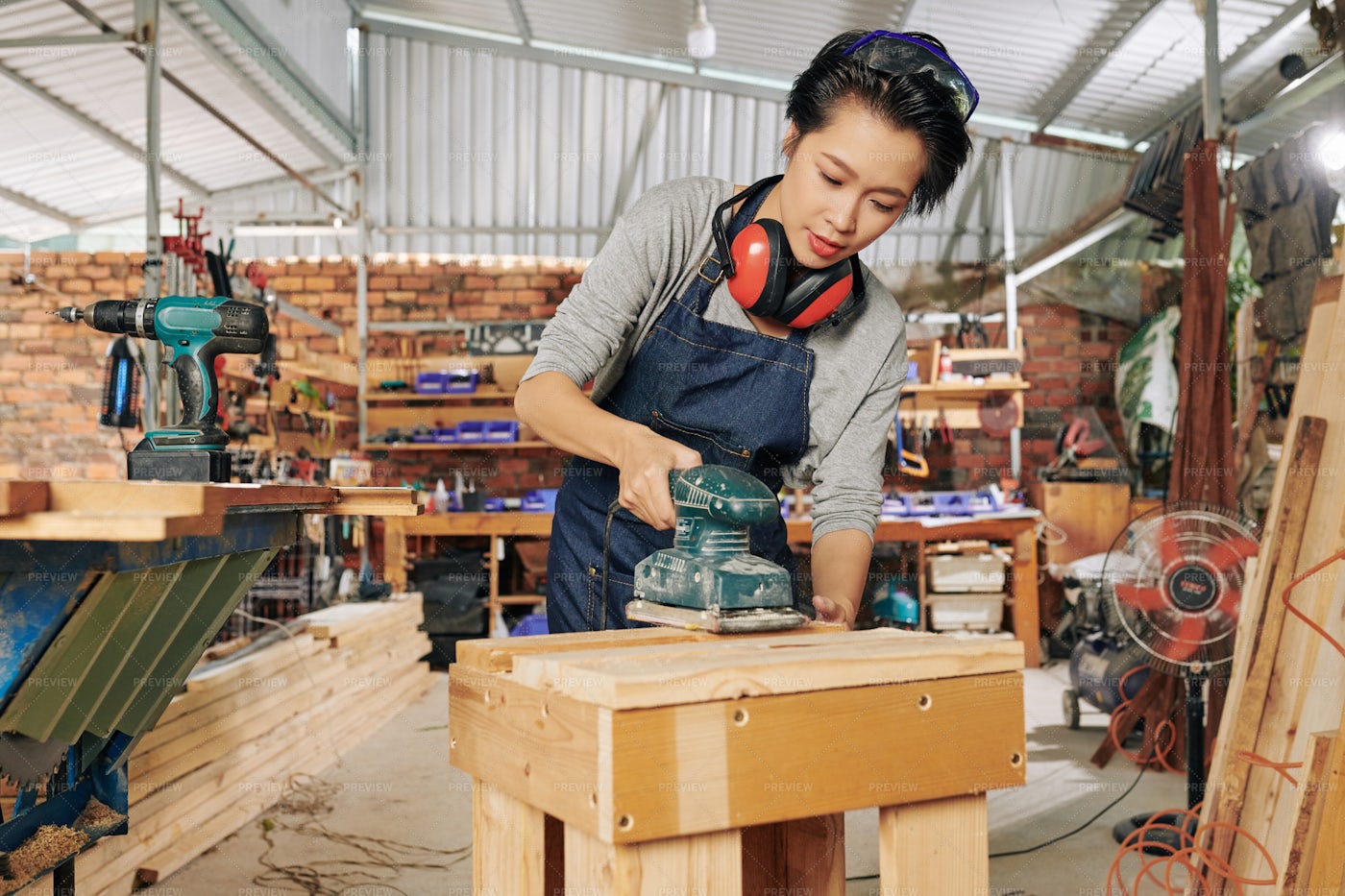 Carpenter Polishing Wooden Surface: Stock Photos