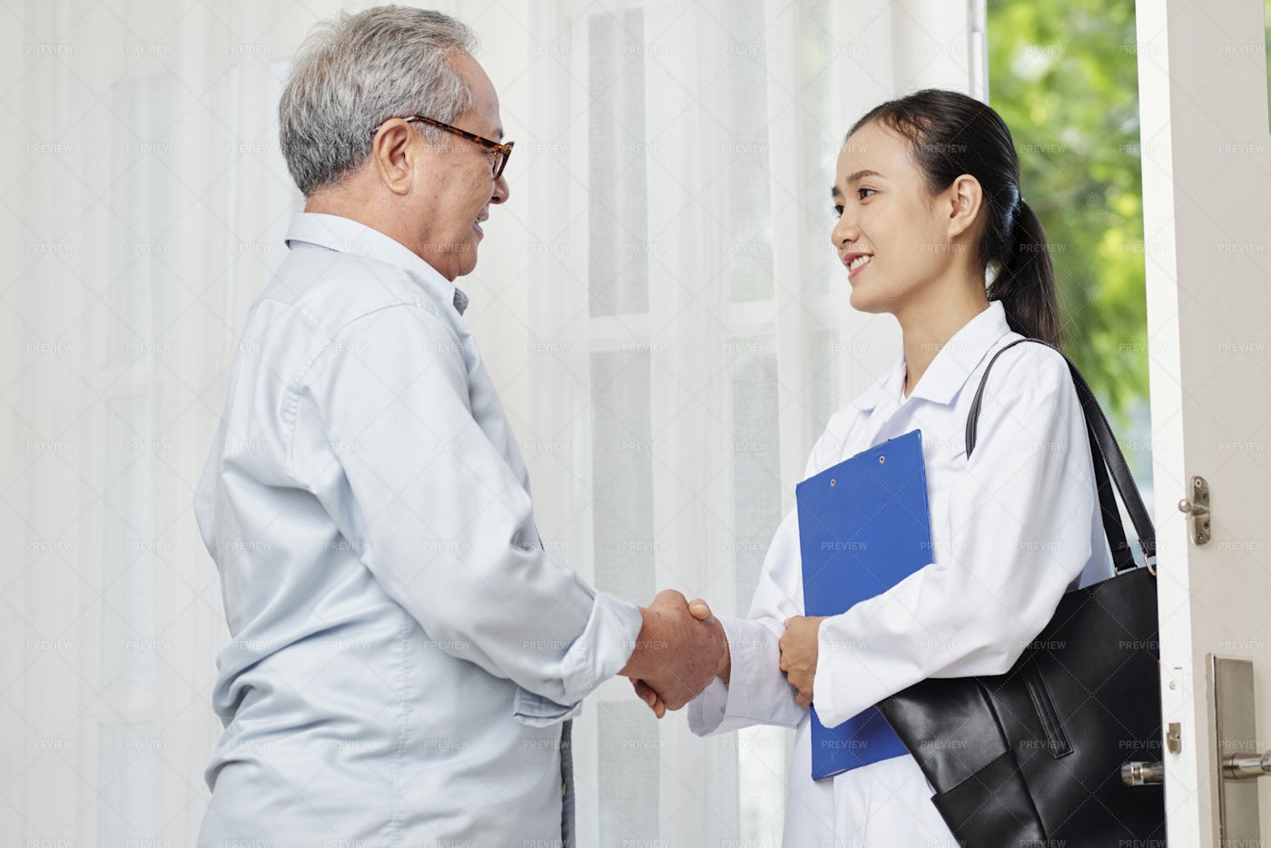 Patient And Doctor Shaking Hands: Stock Photos