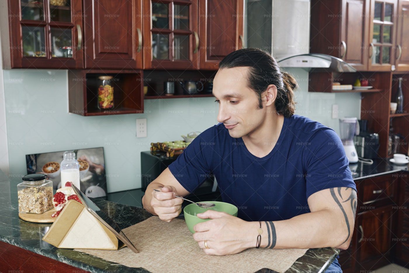 Man Having Breakfast In The Kitchen: Stock Photos