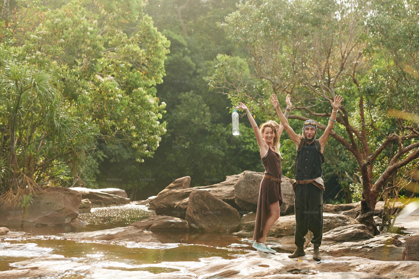 Happy Travelers Standing At Brook: Stock Photos