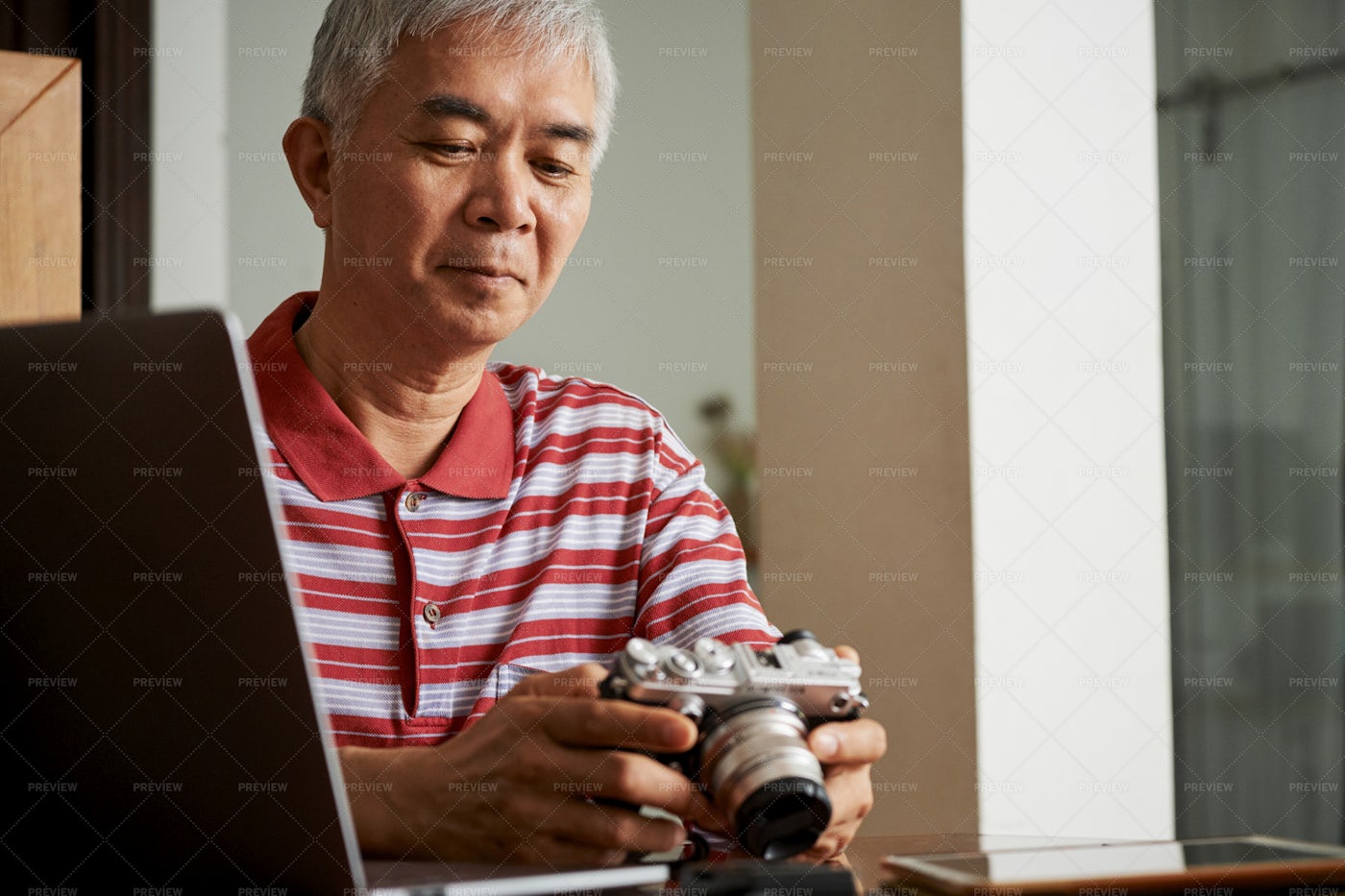 Man Working With Photos After Shooting: Stock Photos