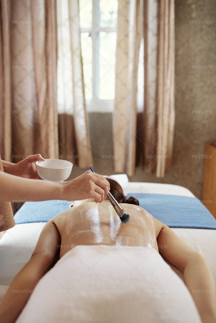 Beautician Applying Nourishing Mask: Stock Photos
