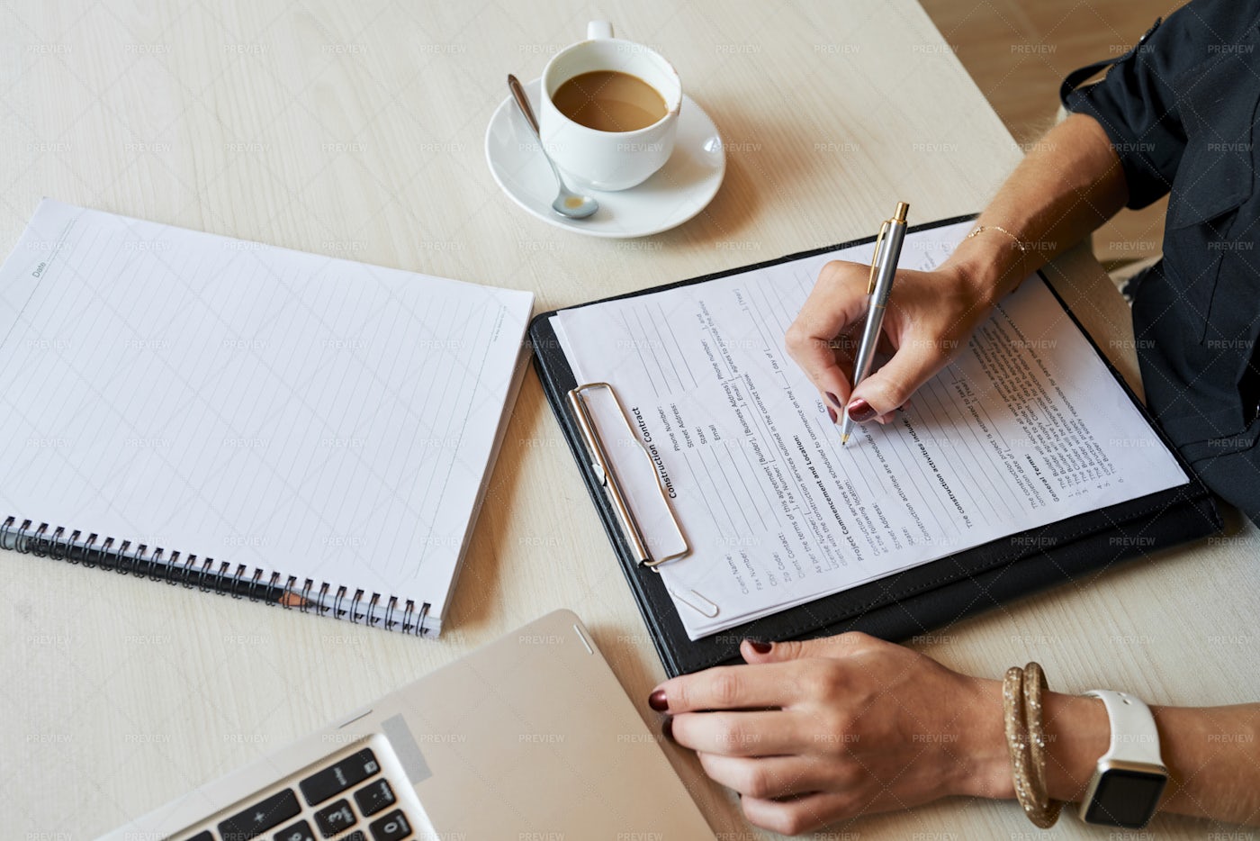 Female Entrepreneur Filling Document: Stock Photos