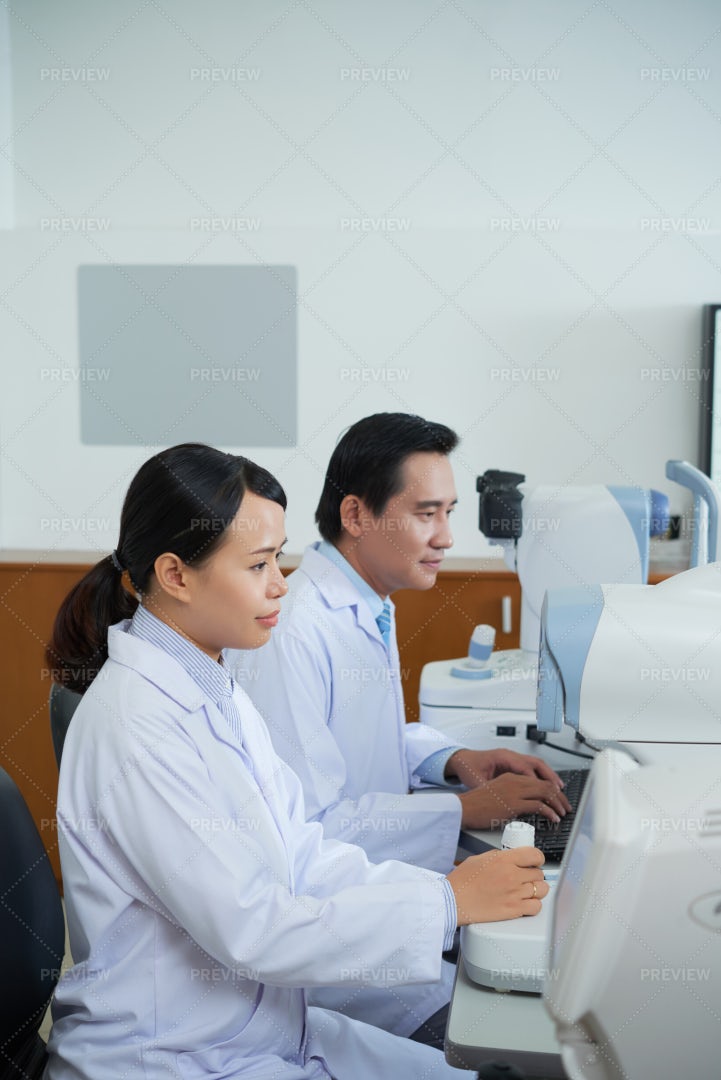 Two Doctors Working In Team At Office: Stock Photos