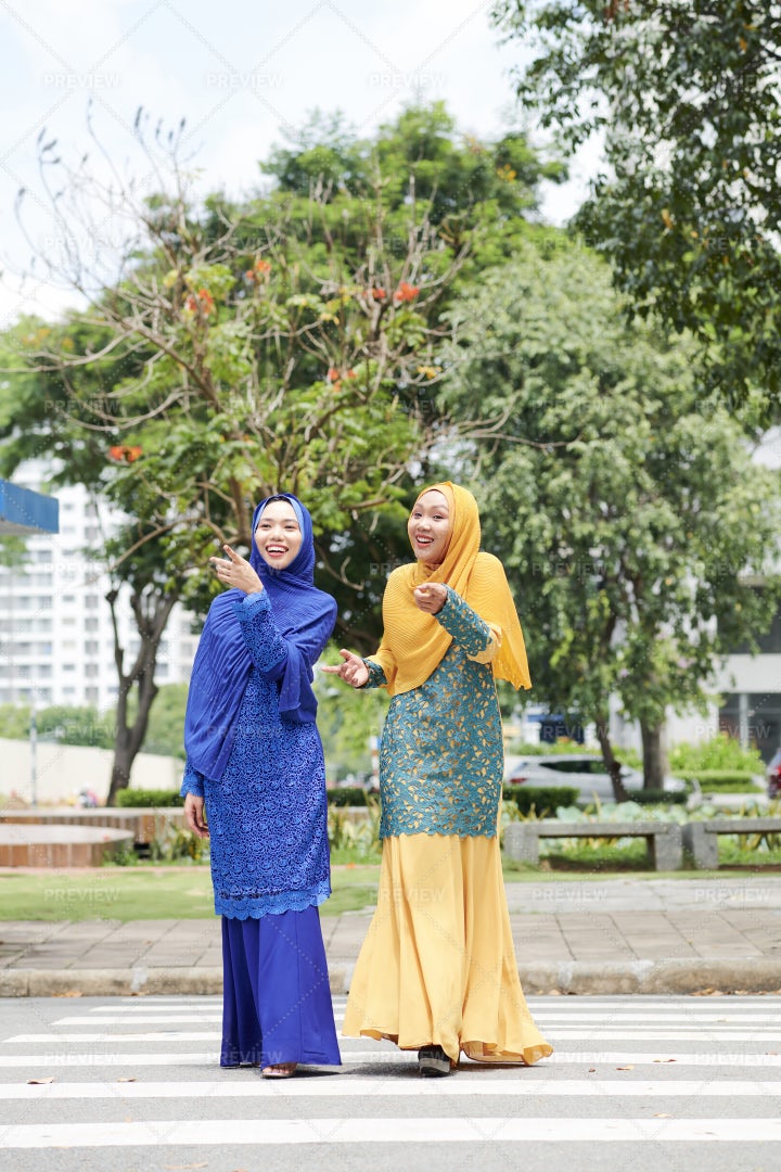 Cheerful Muslim Women In The City: Stock Photos
