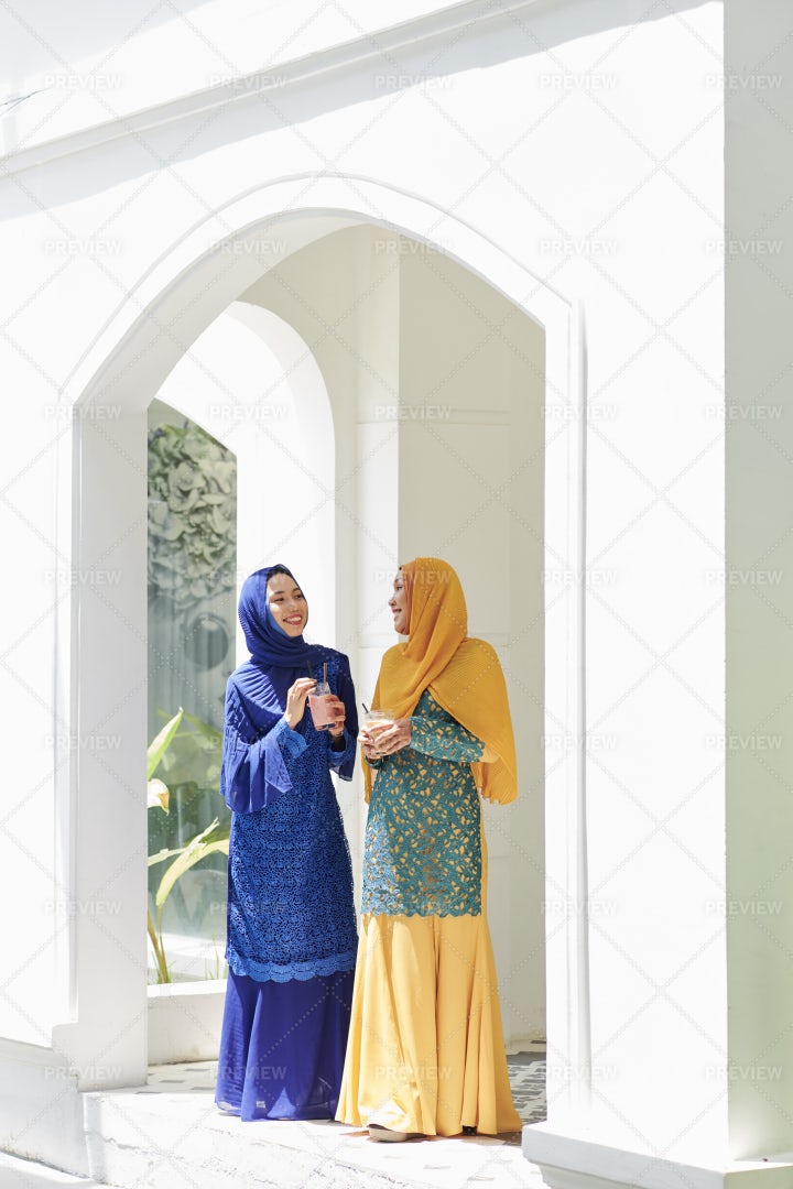 Muslim Women Chatting At Party: Stock Photos
