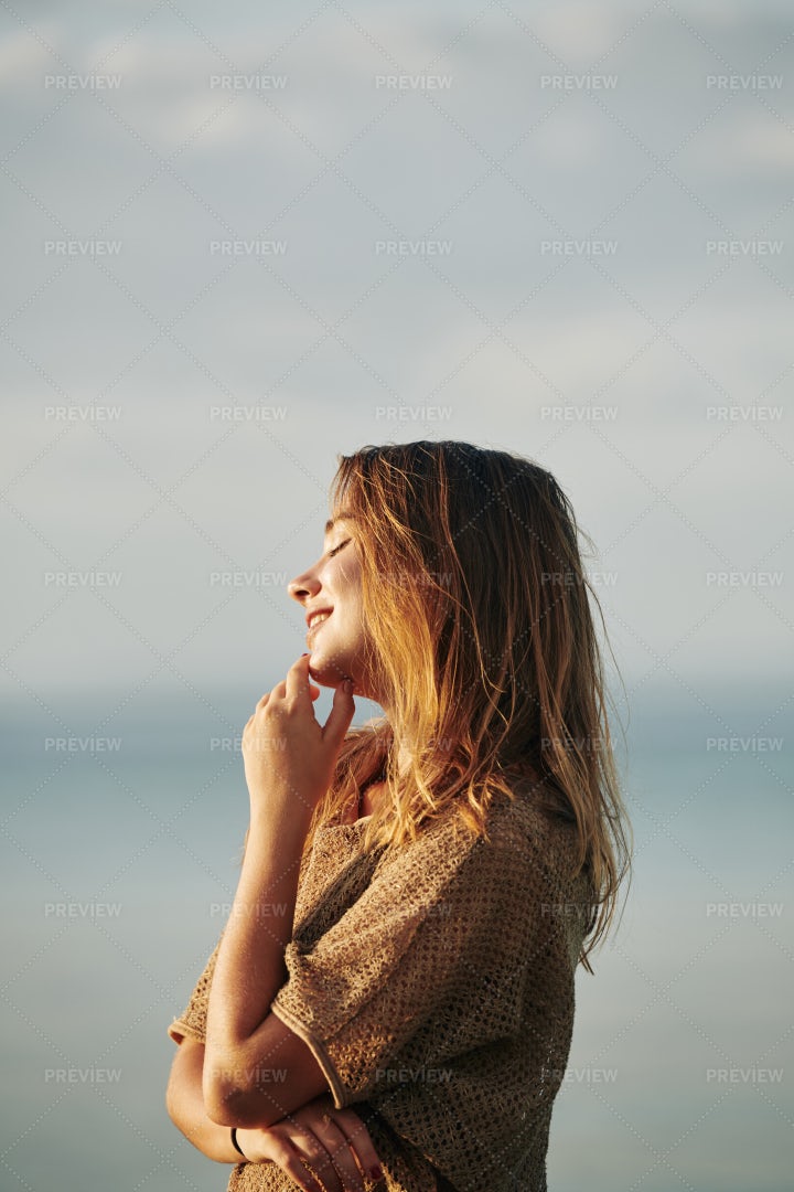 Woman Standing In Sunset Sun Rays: Stock Photos