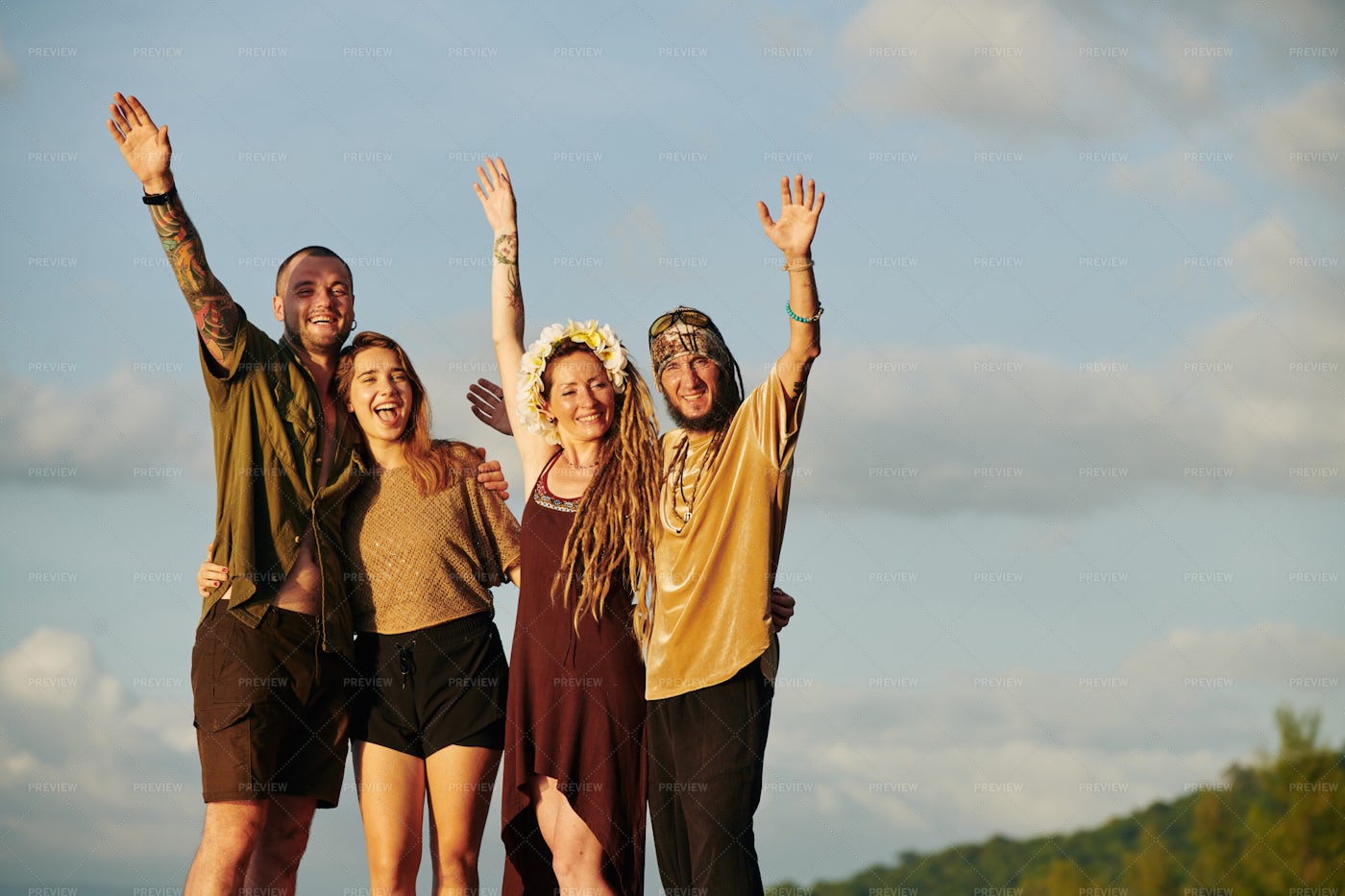 Joyful Friends In Sunset Sun Rays: Stock Photos