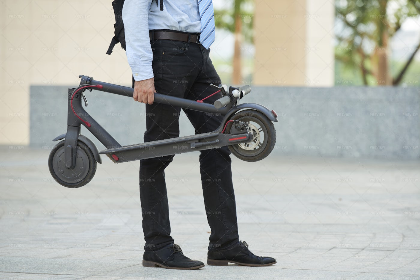 Man With Scooter Standing Outdoors: Stock Photos